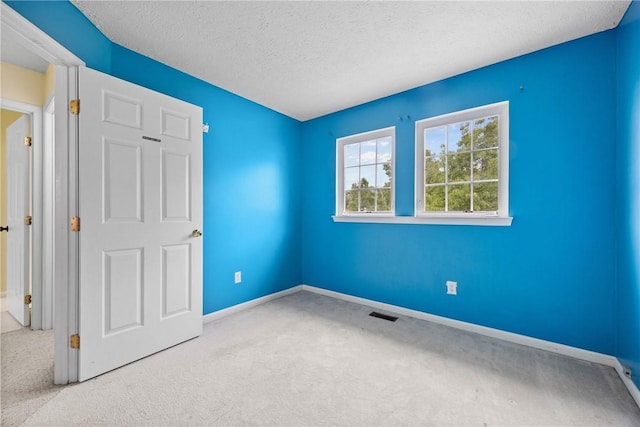 18 Butterfly Ln, Henrietta, NY 14586 - unfurnished bedroom featuring carpet flooring and a textured ceiling
