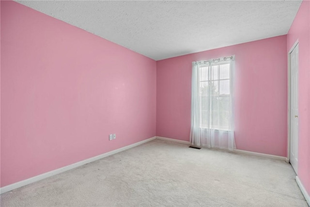 18 Butterfly Ln, Henrietta, NY 14586 - carpeted empty room featuring a textured ceiling and baseboards