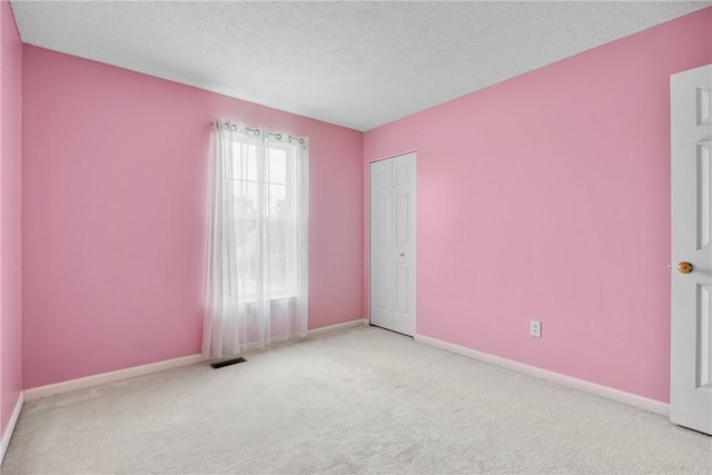 18 Butterfly Ln, Henrietta, NY 14586 - unfurnished room with carpet flooring and a textured ceiling