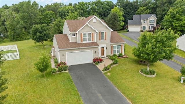 18 Butterfly Ln, Henrietta, NY 14586 - traditional-style home featuring asphalt driveway and roof with shingles