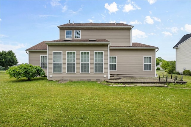 18 Butterfly Ln, Henrietta, NY 14586 - rear view of property with a lawn and a patio