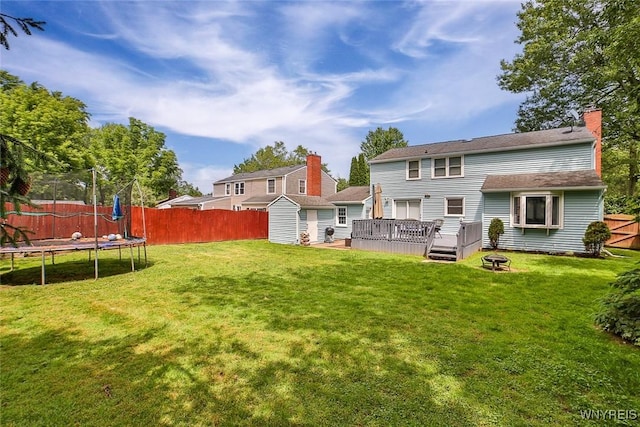 170 Sargent Dr, Amherst, NY 14226 - back of house with a trampoline, a deck, a fenced backyard, and a storage shed