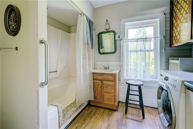 212 Hill Rd, Danby, NY 14001 - full bathroom featuring washer / dryer, curtained shower, vanity, and wood finished floors