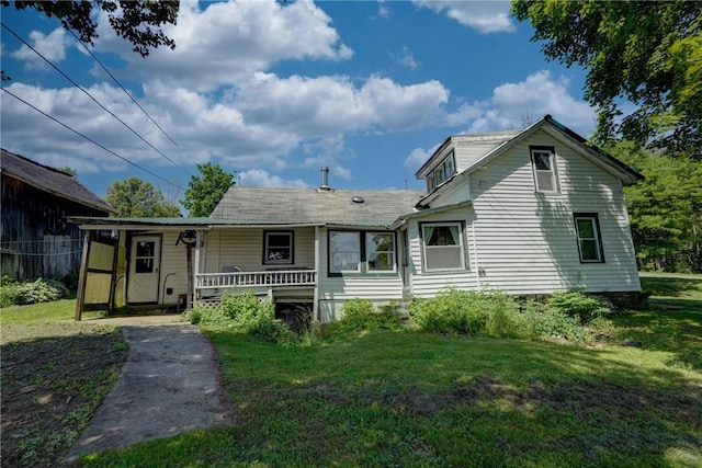 212 Hill Rd, Danby, NY 14001 - view of front facade featuring covered porch and a front lawn