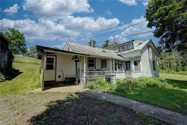 212 Hill Rd, Danby, NY 14001 - view of front of home featuring a porch and a front lawn