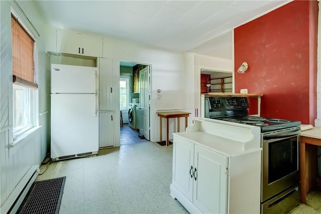 212 Hill Rd, Danby, NY 14001 - kitchen with freestanding refrigerator, range with electric stovetop, a baseboard heating unit, light floors, and white cabinets
