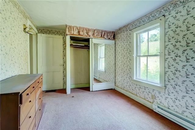 212 Hill Rd, Danby, NY 14001 - unfurnished bedroom featuring wallpapered walls, light colored carpet, a closet, and a baseboard radiator