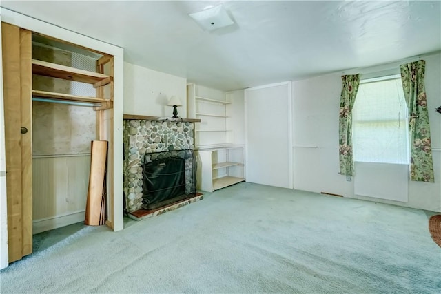 212 Hill Rd, Danby, NY 14001 - unfurnished living room with carpet flooring and a stone fireplace
