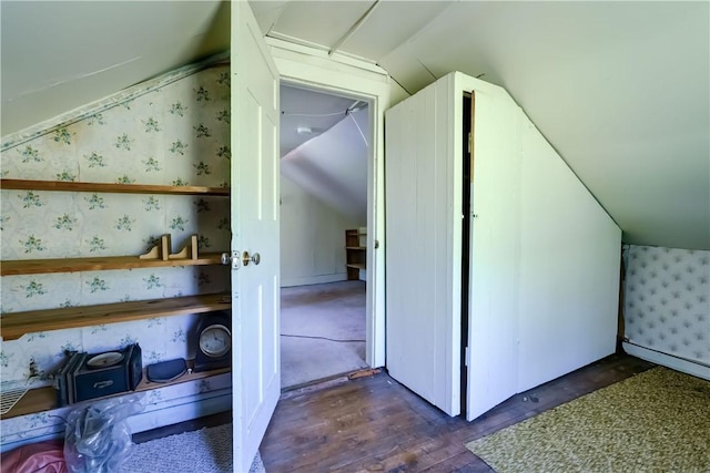212 Hill Rd, Danby, NY 14001 - additional living space with lofted ceiling, wallpapered walls, and dark wood-style flooring