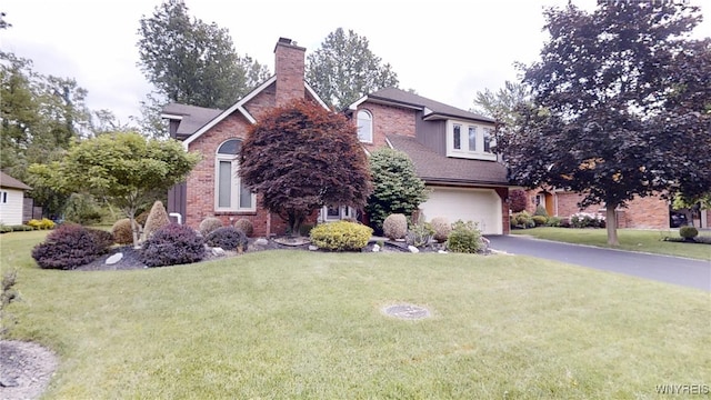 6097 Wellesley Cmn, Clarence, NY 14051 - view of front facade with a garage, driveway, a chimney, a front lawn, and brick siding