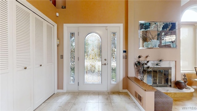 6097 Wellesley Cmn, Clarence, NY 14051 - entryway with healthy amount of natural light and a towering ceiling
