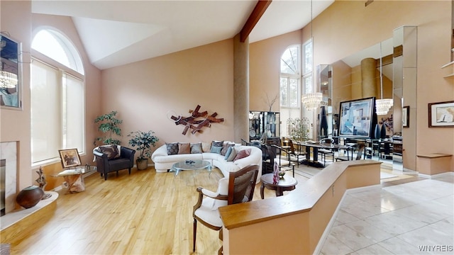 6097 Wellesley Cmn, Clarence, NY 14051 - living area featuring high vaulted ceiling and wood finished floors