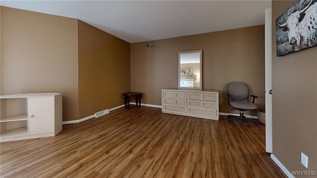 6097 Wellesley Cmn, Clarence, NY 14051 - unfurnished office with wood finished floors and baseboards