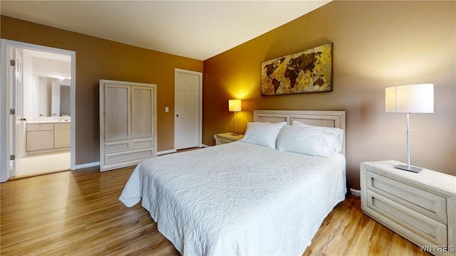 6097 Wellesley Cmn, Clarence, NY 14051 - bedroom with wood finished floors and ensuite bathroom