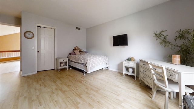 6097 Wellesley Cmn, Clarence, NY 14051 - bedroom featuring light wood finished floors and baseboards