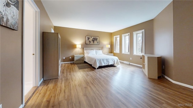 6097 Wellesley Cmn, Clarence, NY 14051 - bedroom with light wood finished floors