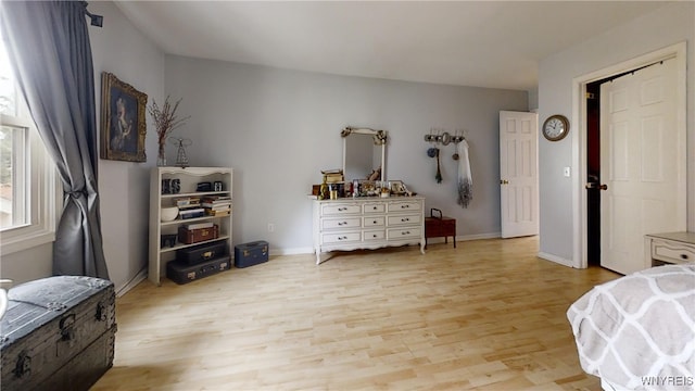 6097 Wellesley Cmn, Clarence, NY 14051 - bedroom featuring light wood finished floors and baseboards