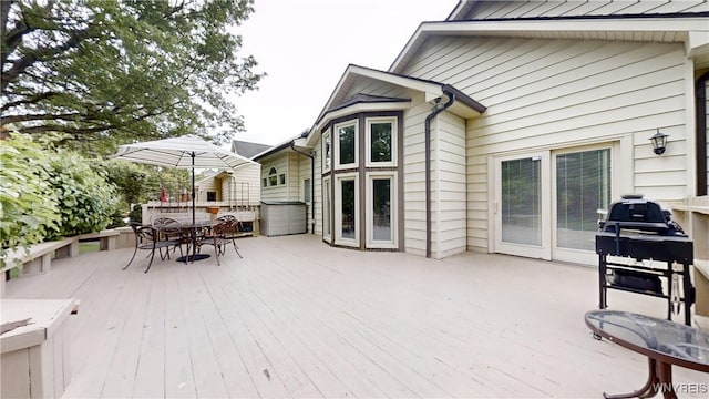 6097 Wellesley Cmn, Clarence, NY 14051 - wooden deck with outdoor dining area
