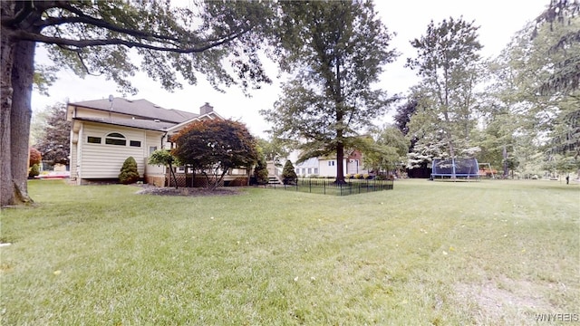 6097 Wellesley Cmn, Clarence, NY 14051 - view of yard with a trampoline