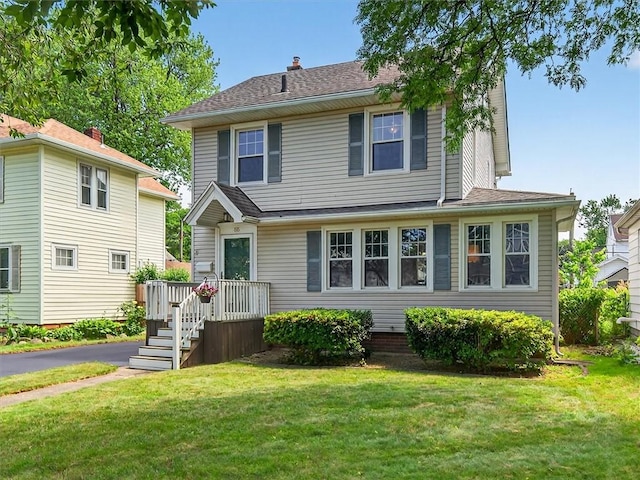 55 Morville Dr, Rochester, NY 14615 - view of front of house with a front lawn and a deck