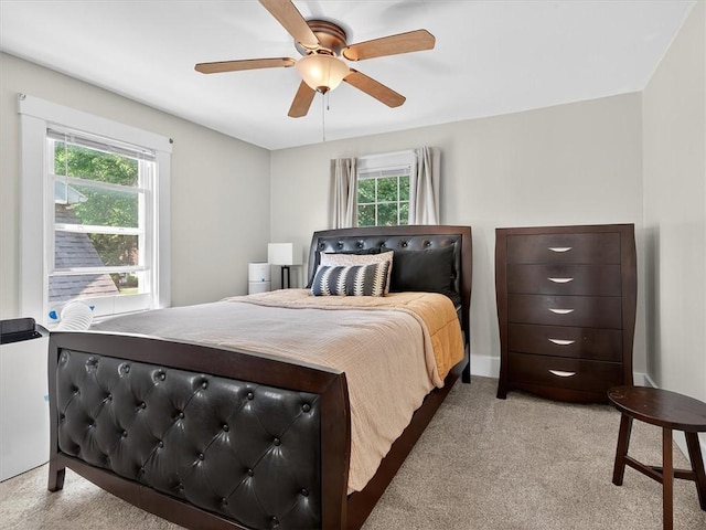 55 Morville Dr, Rochester, NY 14615 - bedroom with light colored carpet, multiple windows, and a ceiling fan