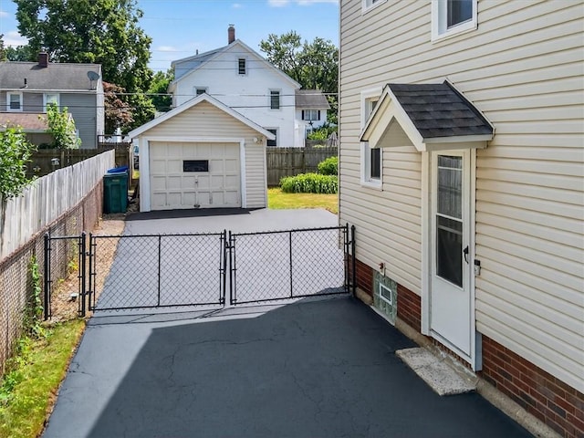 55 Morville Dr, Rochester, NY 14615 - detached garage with a gate and driveway