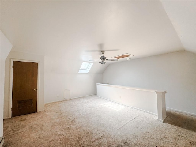 124 Adams St, Rochester, NY 14608 - additional living space featuring vaulted ceiling, carpet flooring, a ceiling fan, and a skylight