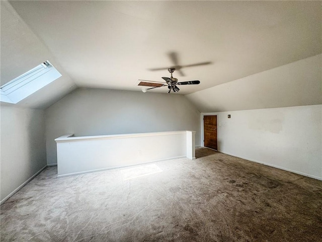 124 Adams St, Rochester, NY 14608 - additional living space featuring vaulted ceiling, carpet, ceiling fan, and a skylight