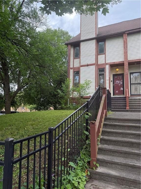 124 Adams St, Rochester, NY 14608 - view of front facade with a chimney