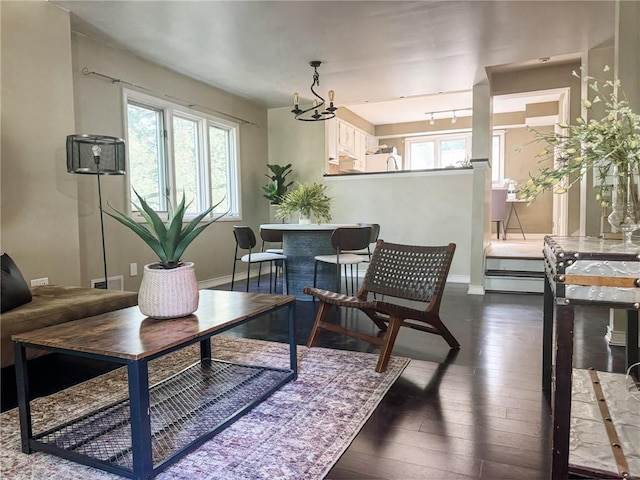 124 Adams St, Rochester, NY 14608 - living area with dark wood finished floors and baseboards