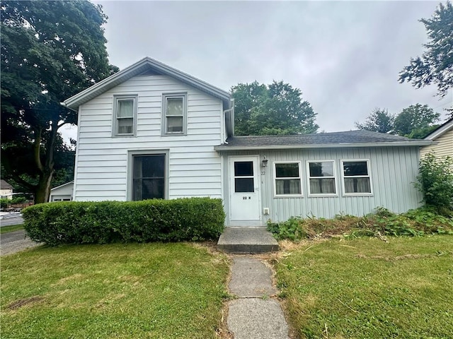 22 N Main St, Elba, NY 14058 - traditional-style house with a front lawn, board and batten siding, and a shingled roof