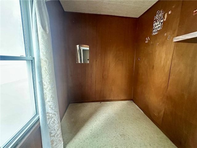 22 N Main St, Elba, NY 14058 - spare room featuring wooden walls and baseboards