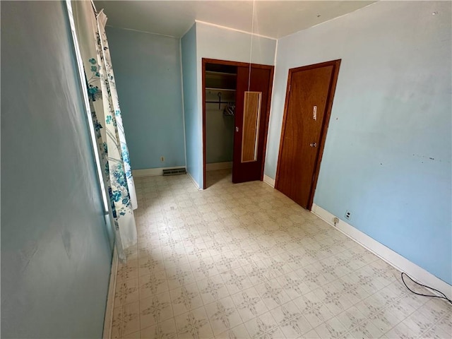 22 N Main St, Elba, NY 14058 - unfurnished bedroom featuring tile patterned floors and a closet