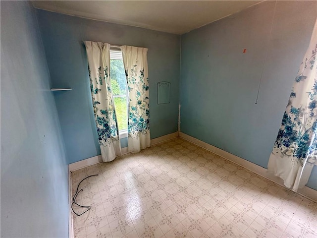 22 N Main St, Elba, NY 14058 - spare room with tile patterned floors and baseboards