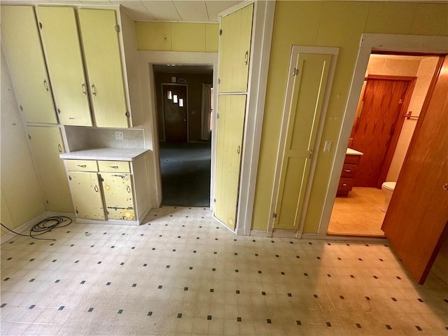 22 N Main St, Elba, NY 14058 - kitchen with light flooring, light countertops, and cream cabinets