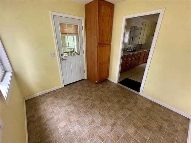 22 N Main St, Elba, NY 14058 - doorway featuring baseboards and a sink