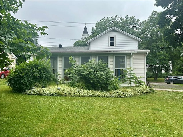 22 N Main St, Elba, NY 14058 - view of front of property with a front lawn