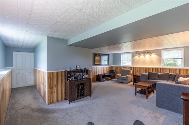 11 Wenrich Cir, Henrietta, NY 14586 - living room with wainscoting, wood walls, and carpet