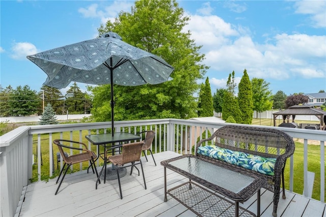 11 Wenrich Cir, Henrietta, NY 14586 - deck featuring a gazebo, outdoor dining area, and a lawn