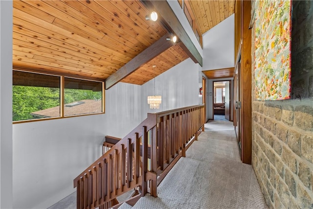 4570 Vine Rd, Jerusalem, NY 14527 - hallway with an upstairs landing, carpet, wooden ceiling, and a chandelier