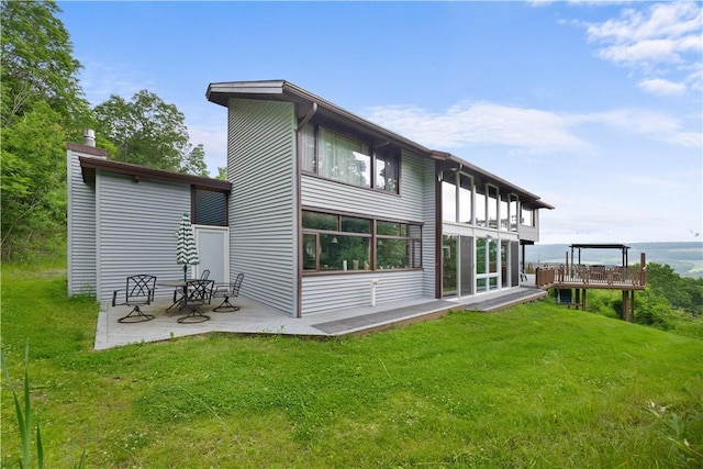 4570 Vine Rd, Jerusalem, NY 14527 - back of house with a lawn, a patio, and a chimney
