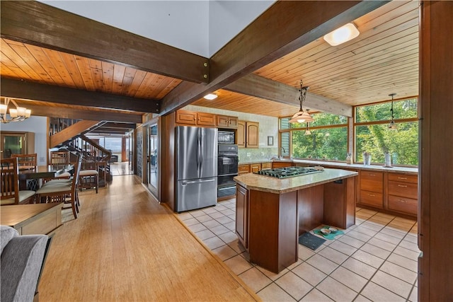 4570 Vine Rd, Jerusalem, NY 14527 - kitchen featuring black appliances, light countertops, a wood ceiling with exposed beams, a kitchen island, and brown cabinets
