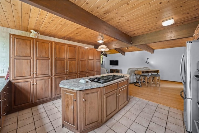 4570 Vine Rd, Jerusalem, NY 14527 - kitchen featuring light tile patterned floors, stainless steel appliances, a kitchen island, a wood ceiling with exposed beams, and open floor plan