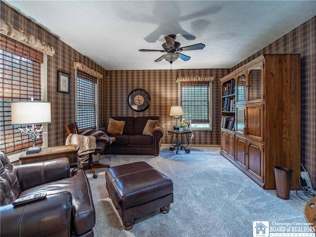 5616 Stow Rd, North Harmony, NY 14710 - living room with wallpapered walls, light carpet, ceiling fan, and a textured ceiling