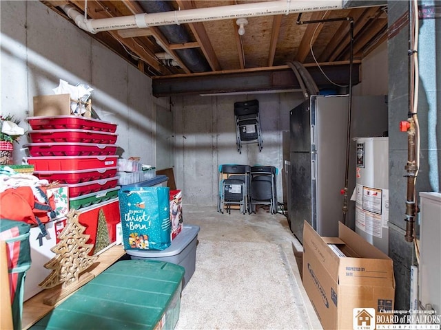 5616 Stow Rd, North Harmony, NY 14710 - unfinished below grade area featuring gas water heater and freestanding refrigerator