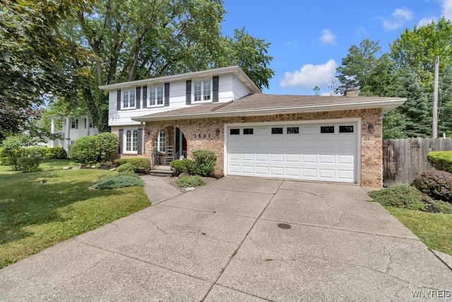 1581 N Forest Rd, Amherst, NY 14221 - traditional home with brick siding, driveway, a garage, and a chimney