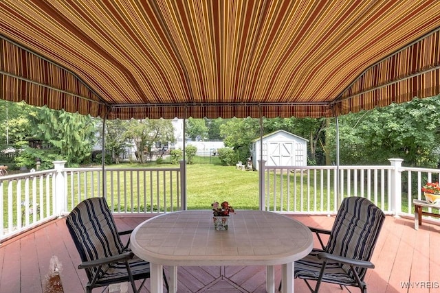 1581 N Forest Rd, Amherst, NY 14221 - view of patio featuring outdoor dining area, a storage shed, and a deck