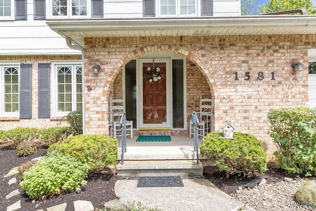 1581 N Forest Rd, Amherst, NY 14221 - entrance to property with brick siding and covered porch