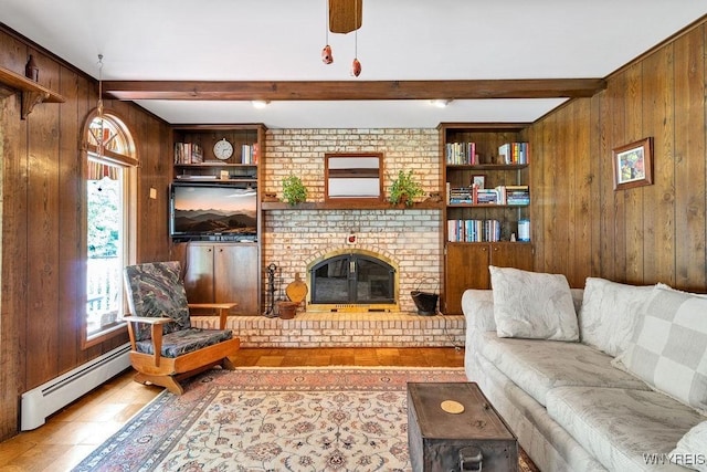 1581 N Forest Rd, Amherst, NY 14221 - living room with wooden walls, beam ceiling, baseboard heating, wood finished floors, and a fireplace