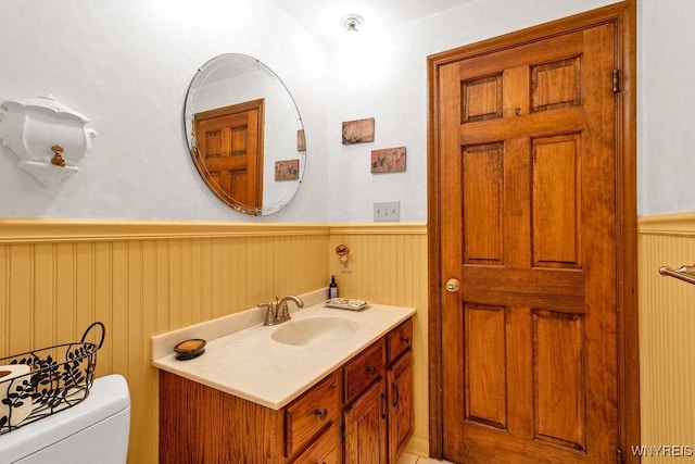 1581 N Forest Rd, Amherst, NY 14221 - bathroom featuring a wainscoted wall and vanity